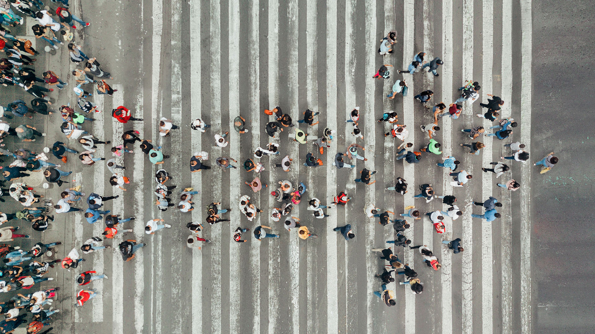 High angle view of people forming an arrow on a street
