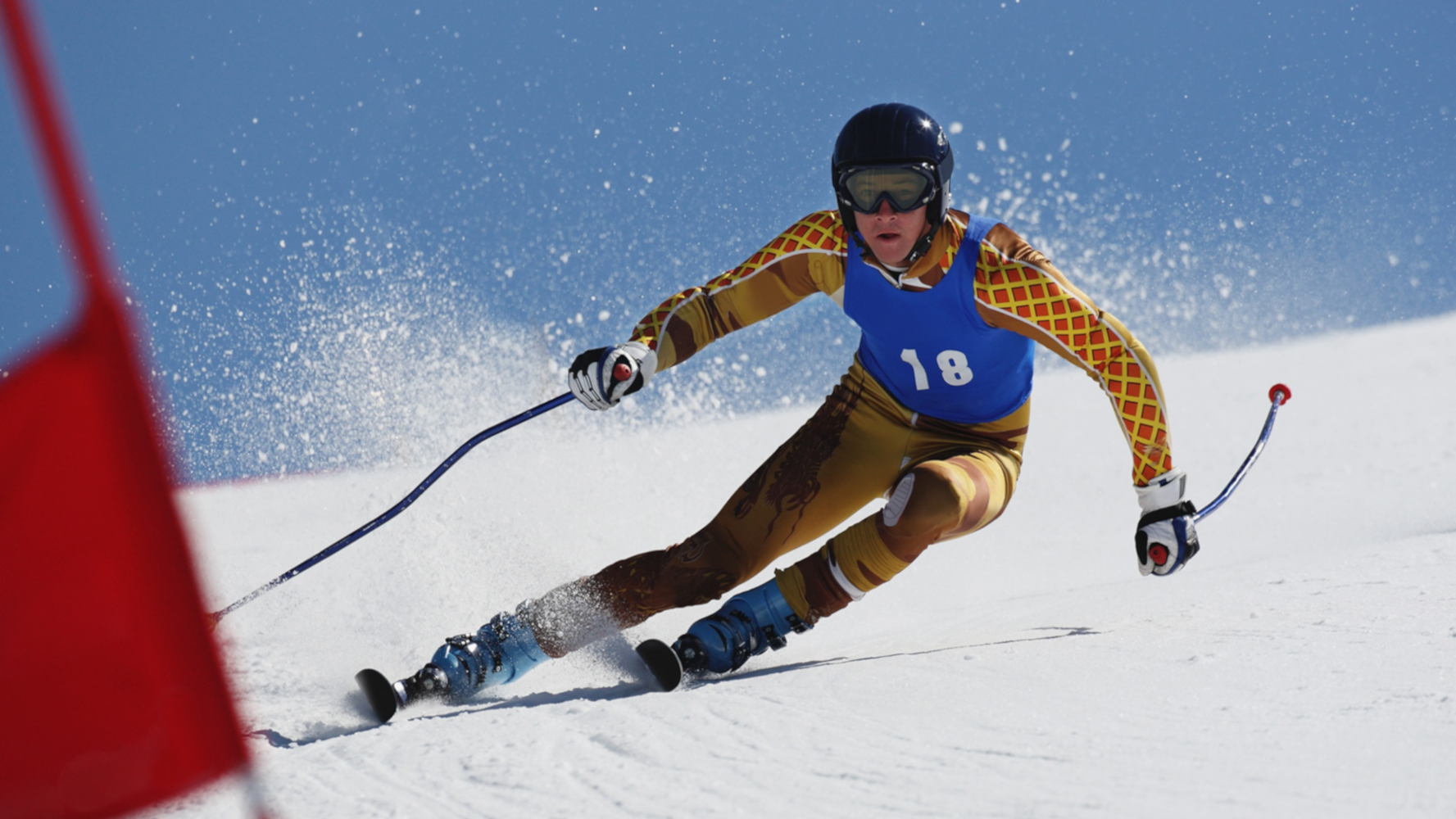 A competitive skiier competing in a slolem
