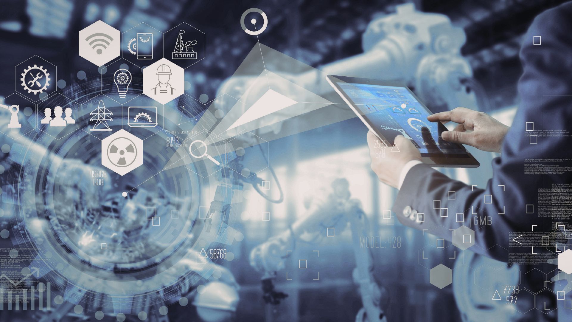 Person using a tablet in a high-tech industrial setting with digital icons, automation graphics and data overlays representing integrated marketing technology.